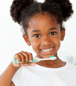 Little girl brushing her teeth